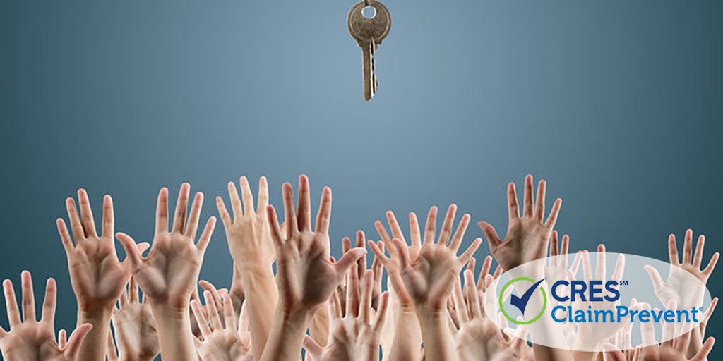 many hands reaching for one key