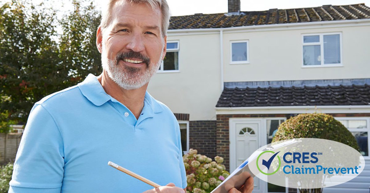 Home inspector in front of a home