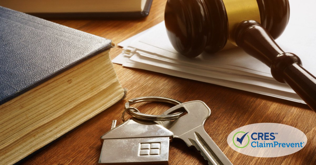 gavel on papers with keys and book