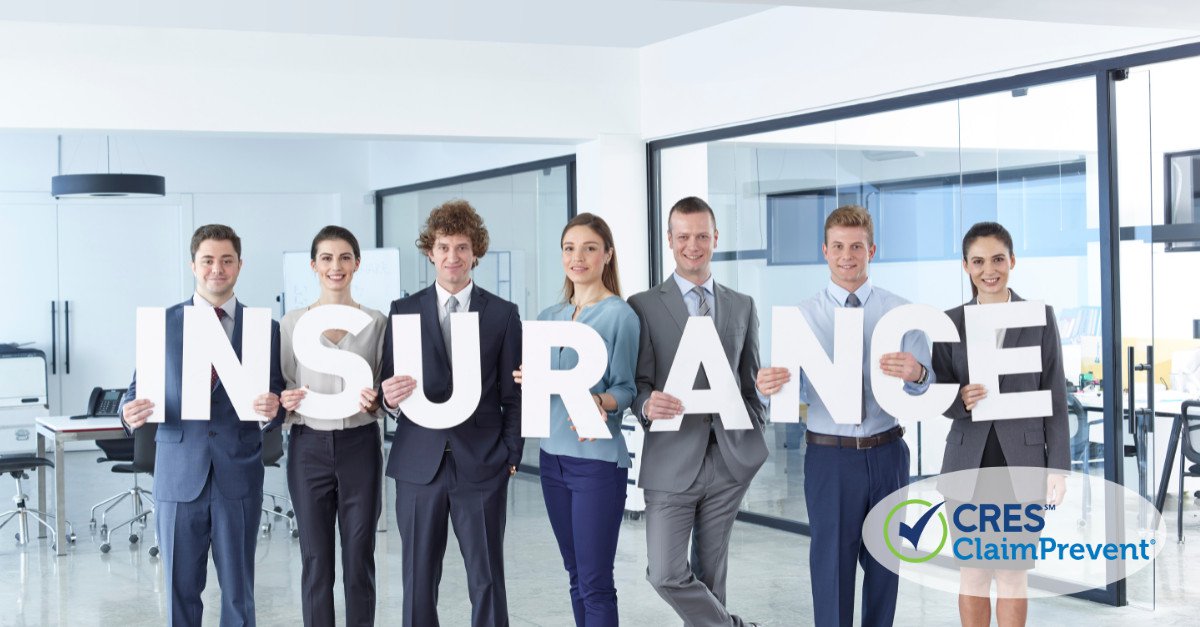 individuals holding letters for insurance in office